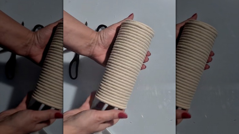 DIY vase made from a Pringles can and cardboard covered in twine