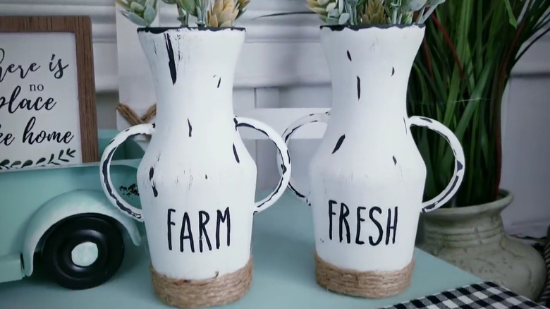 Two Dollar Tree vases decorated with handles, paint, and jute