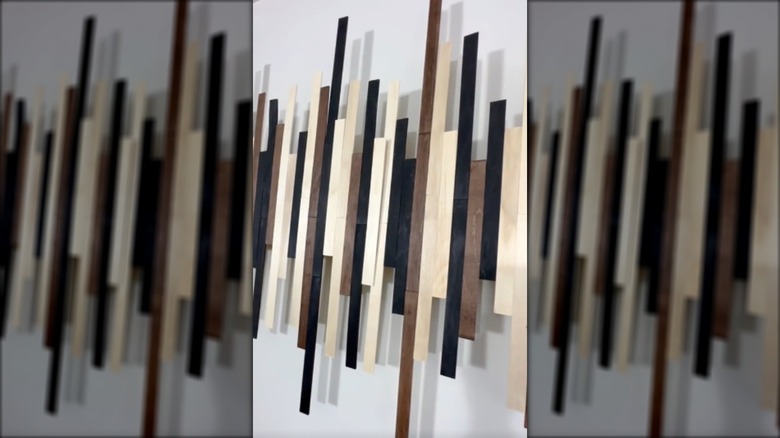 A soundwave wall art made from stir sticks