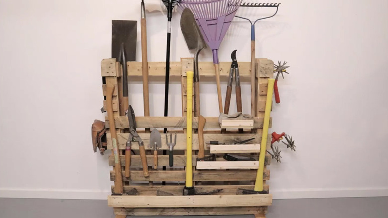 Garden tool storage rack made from a wood pallet