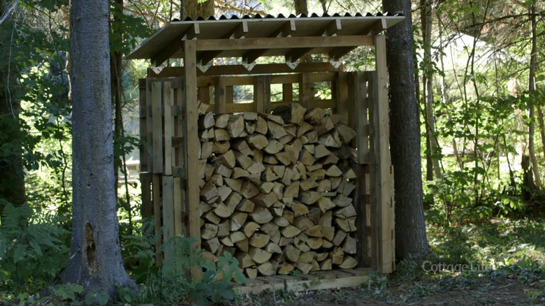A firewood shed made from palettes