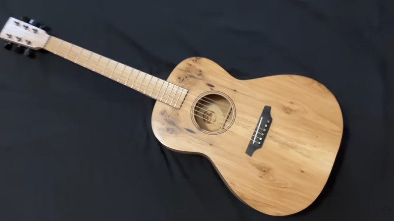 An acoustic guitar made of pallet wood