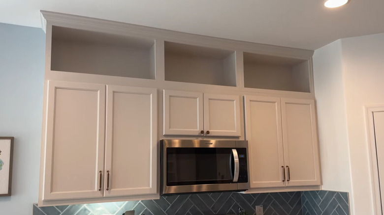 Custom open cabinets extending upper cabinets to the ceiling