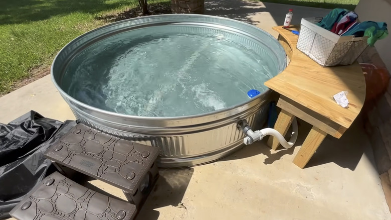 Finished DIY stock tank pool with moving water