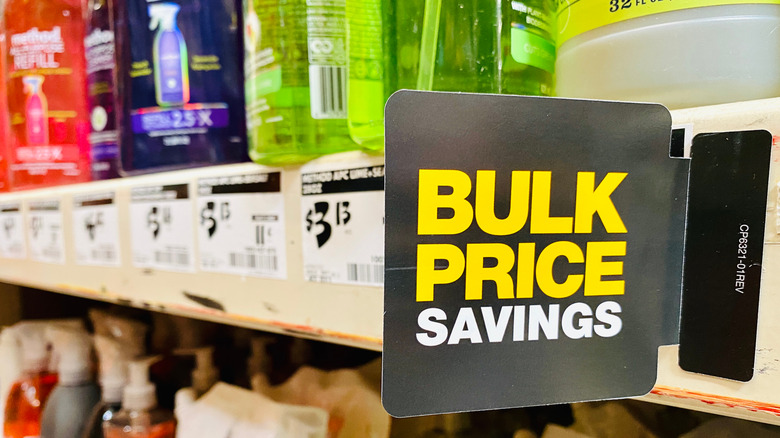 A bulk price saving bill against a shelf