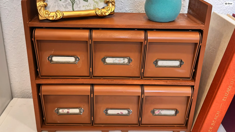 DIY apothecary-style storage bin made from Dollar Tree's tilting storage