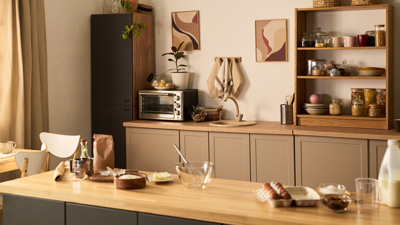 Kitchen counter lined with appliances and utensils