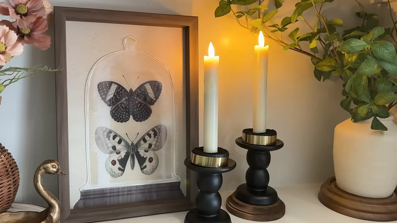 The finished tiered candle holders painted black.