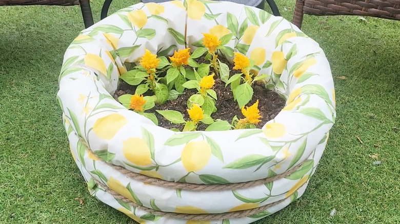 Planter made with three pool noodles wrapped in fabric