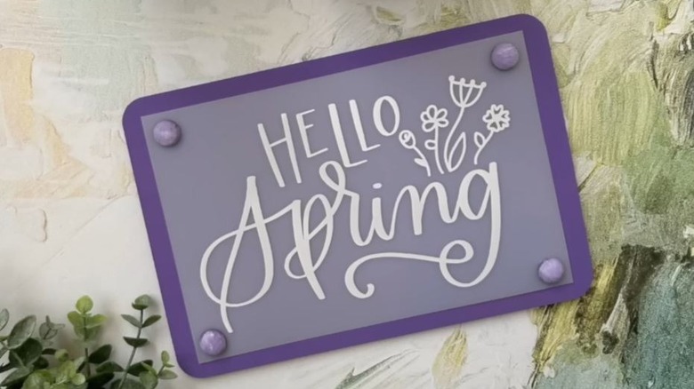 Wooden spring sign made from Dollar Tree cutting board and mat