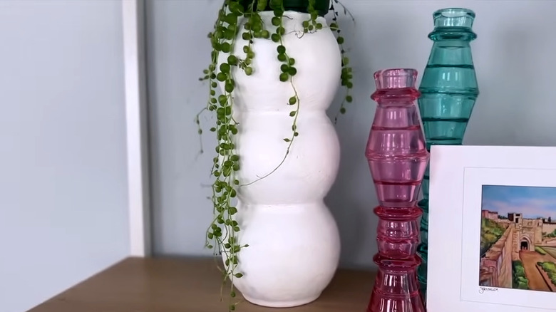 DIY vase made from three round vases stacked and covered with texture material