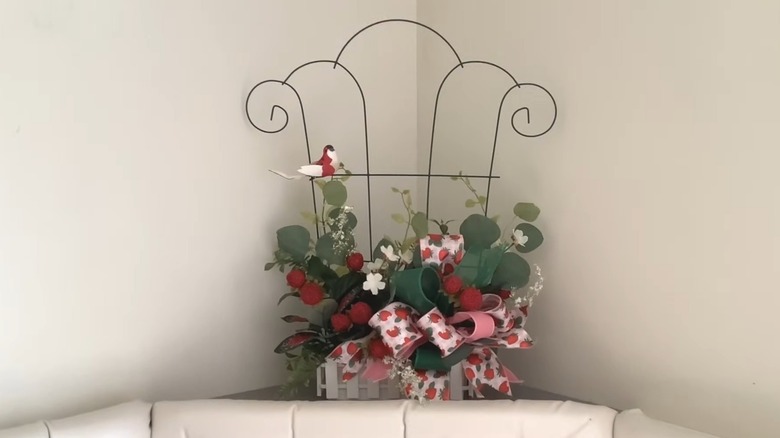 Trellis with box-style planter with faux flowers