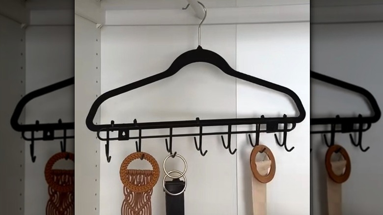Clothes on a multi-hook hanger made from Dollar Tree.