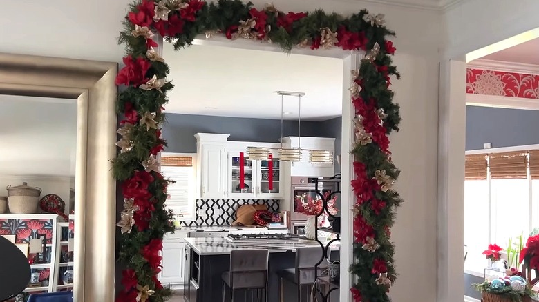 A door arch or garland made from pool noodles and holiday decor