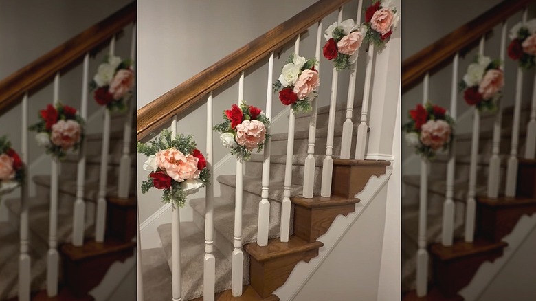 Stairway spindles decorated with pool noodles and faux flowers
