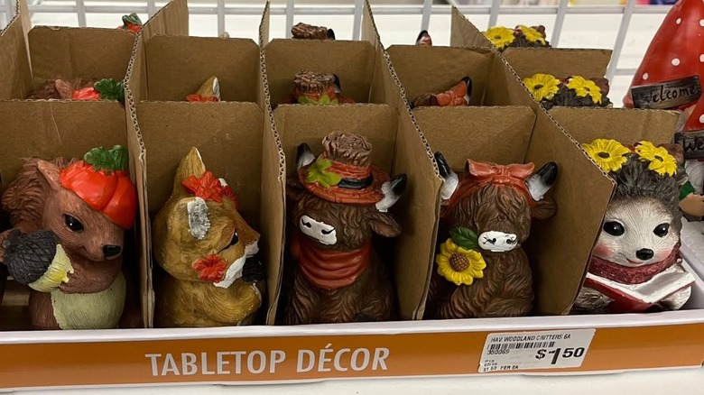 Fall animal figurines are on display at a Dollar Tree shelf
