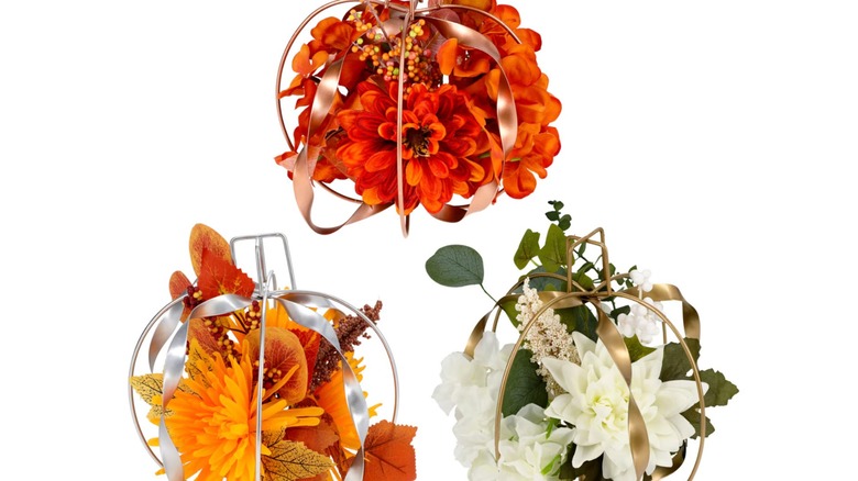 Pumpkin-shaped tabletop centerpieces from Dollar Tree in three different colors