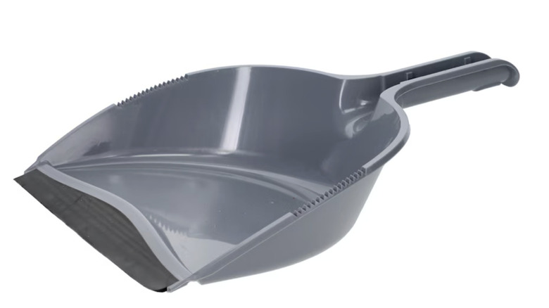 Standard Essentials gray dust pan with a rubber edge on it
