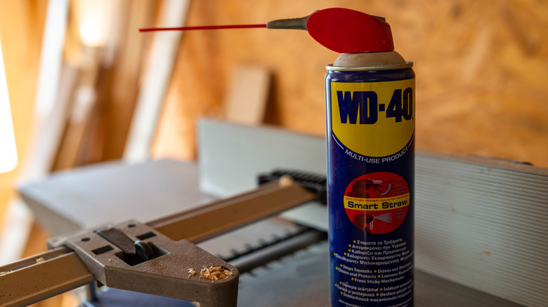 A can of WD-40 on a workshop table