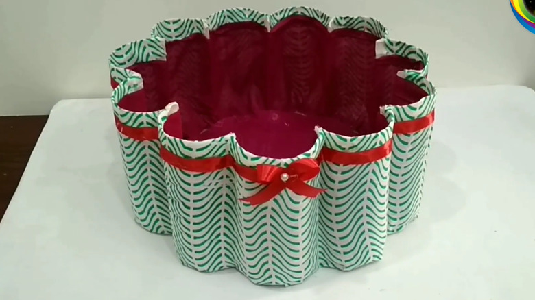 Countertop storage basket made with old plastic bottles covered in fabric