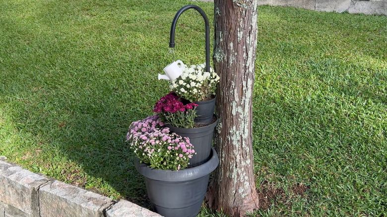 Tiered plant display made from plastic pots