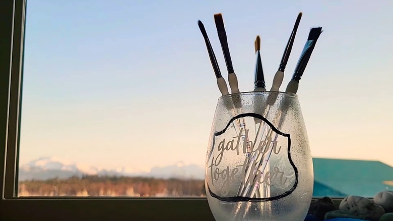 Paint brushes inside a glass holder