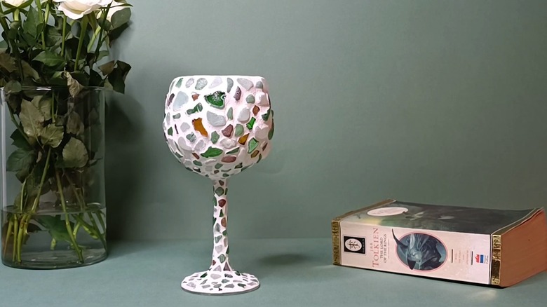 Sea glass glued on a wine glass for a mosaic effect