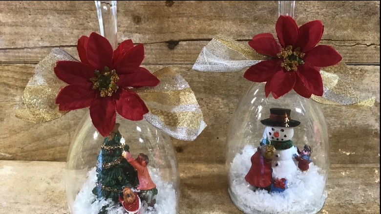 Winter wonderland sceneries inside decorated wine glasses