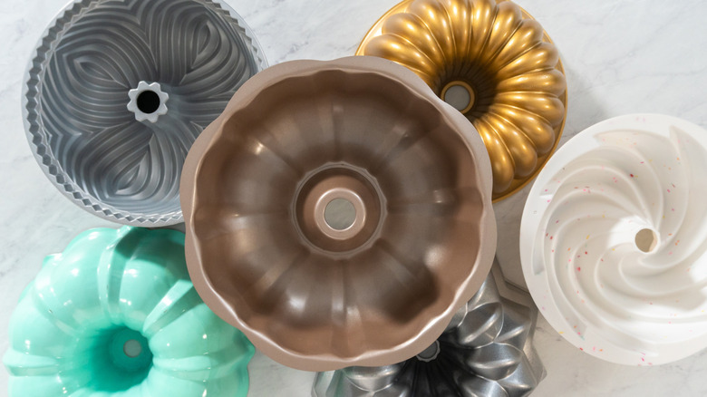 A collection of bundt pans on a table