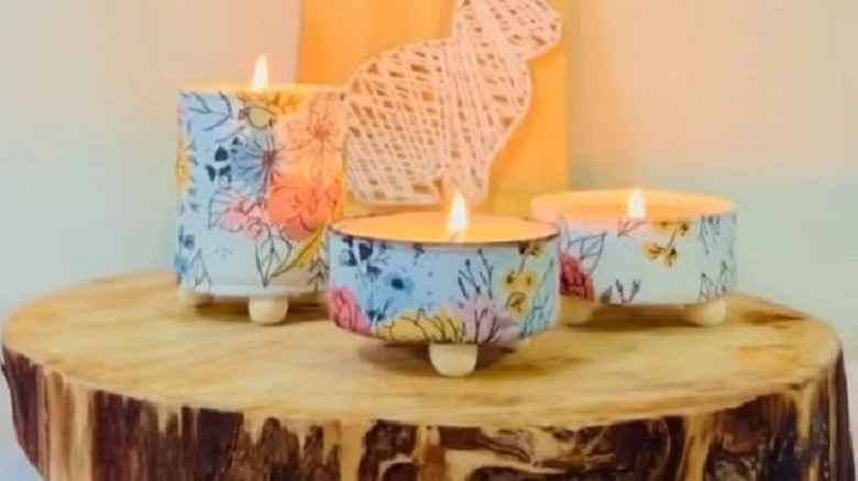 Decoupaged tuna cans turned into candles