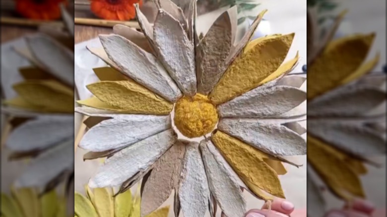 Yellow and white flower made from the dividers of egg cartons