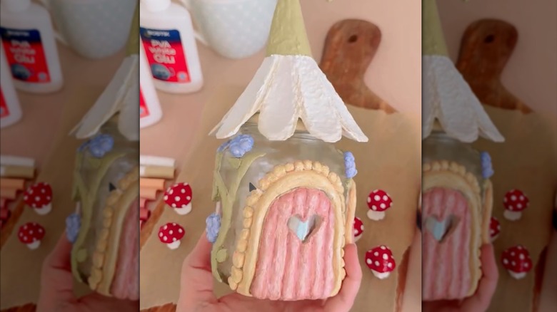The finished fairy house using an egg carton and paper mache decorations.
