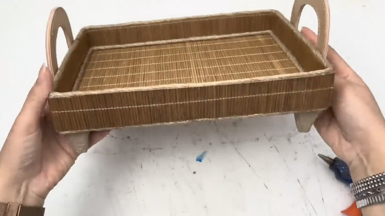 Hands holding DIY storage tray