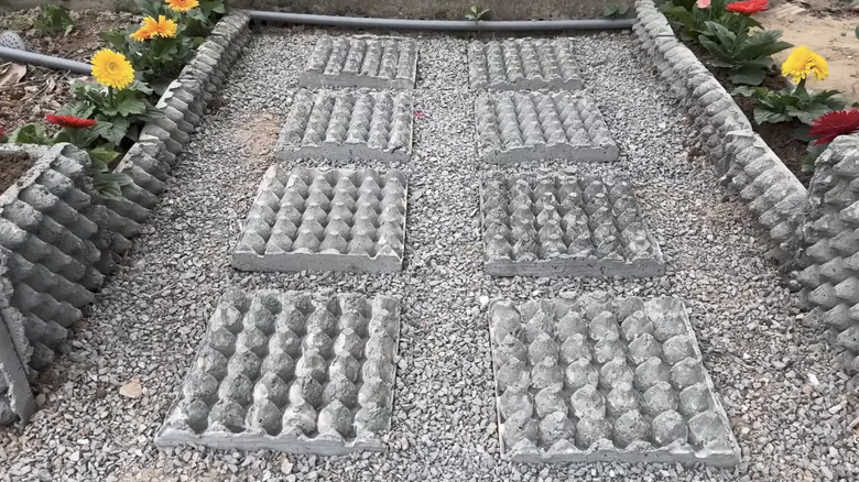 garden area with DIY egg carton pavers