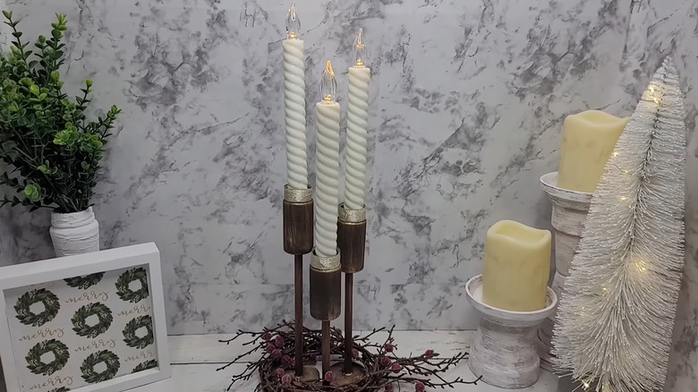 Three candlestick holders made from pill bottles