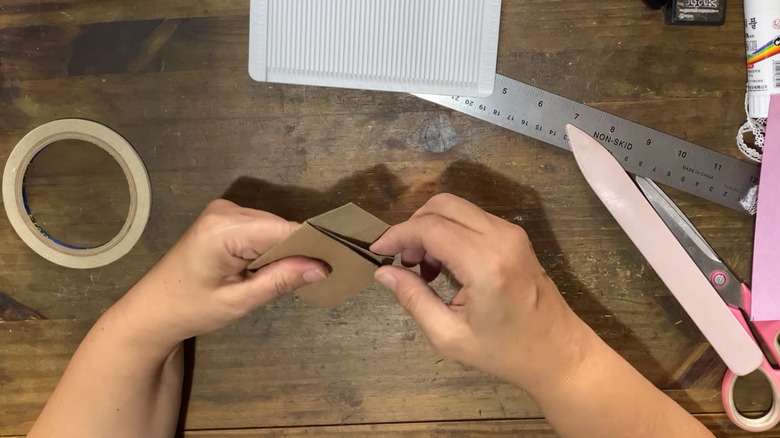 Creator crafts paper envelope