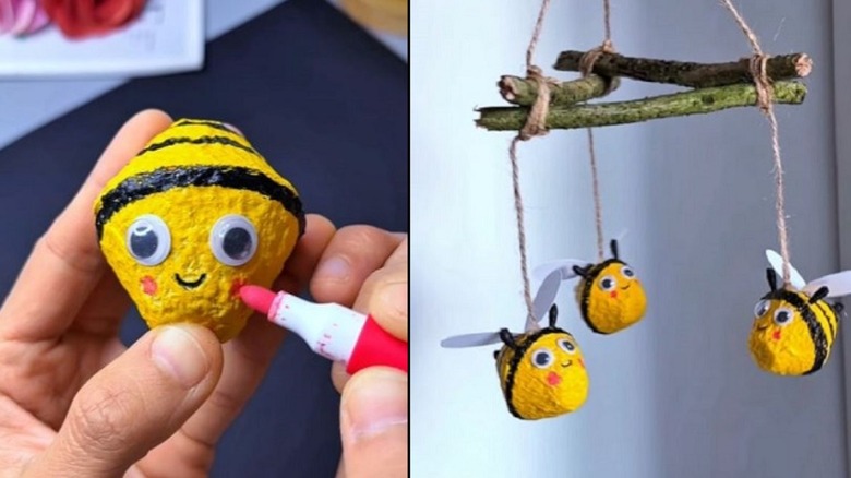 Egg carton turned into hanging bee decor with branch mobile-style holder.