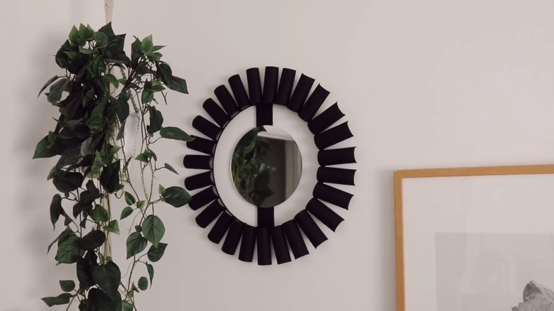 DIY sunburst mirror made from toilet paper rolls