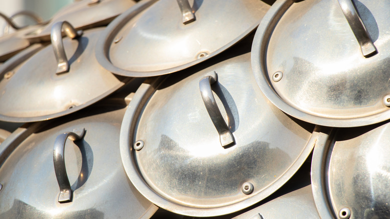 A collection of old pot lids