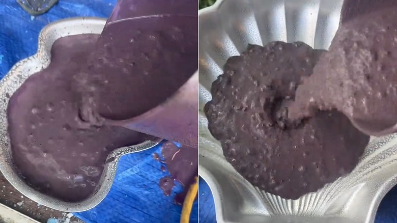 A person pours tinted concrete into cake pan molds