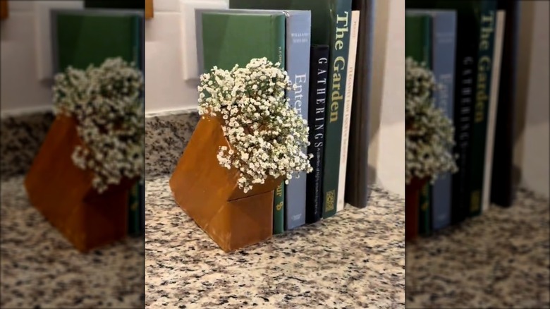 Old knife block used as a bookend for the kitchen countertop