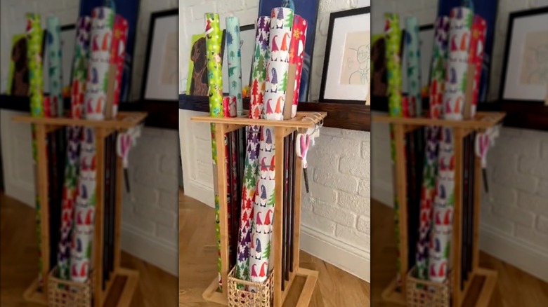 Wooden shoe shelf turned into gift wrapping station with holiday wrapping paper and tools