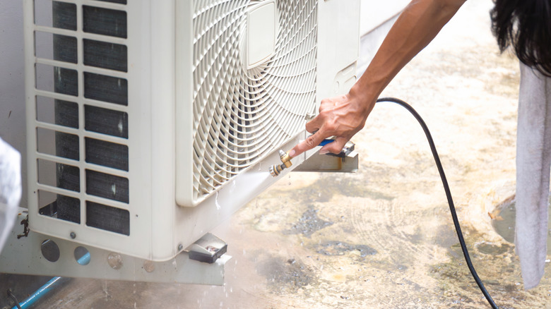 Cleaning an outdoor air conditioner unit