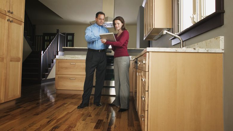 People discussing plan for a renovation in a kitchen