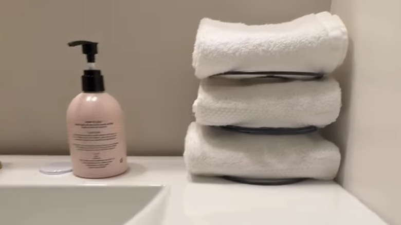 Folded towels in Dollar Tree napkin holders