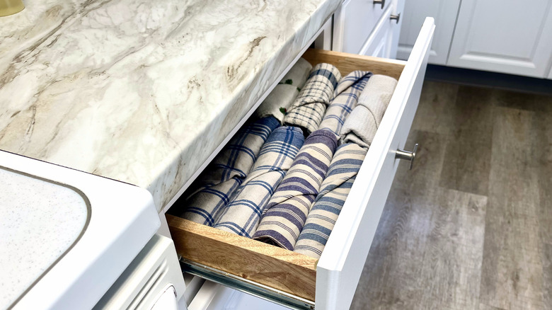 Rolled kitchen towels in drawer