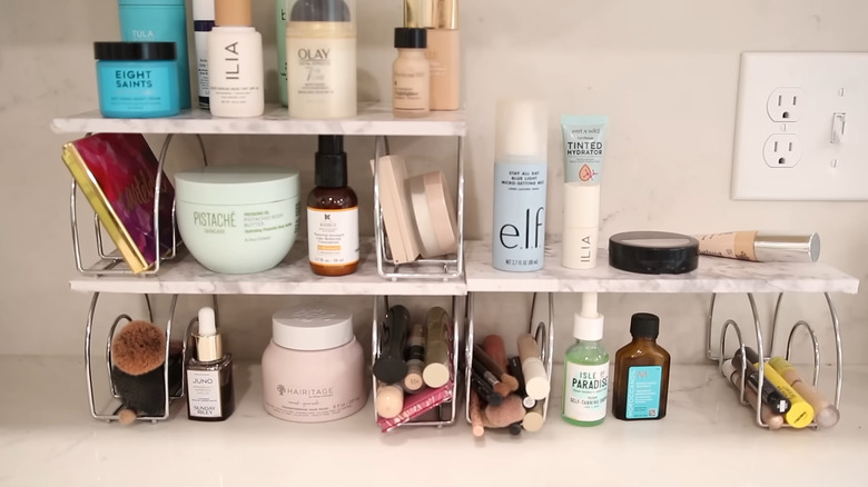 DIY shelves made from Dollar Tree napkin rings with toiletries stored on them
