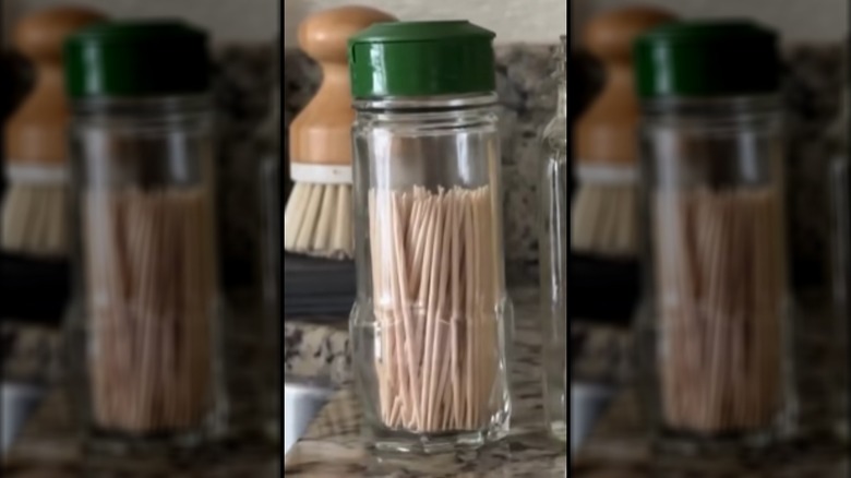 Old spice jar with wooden toothpicks in it
