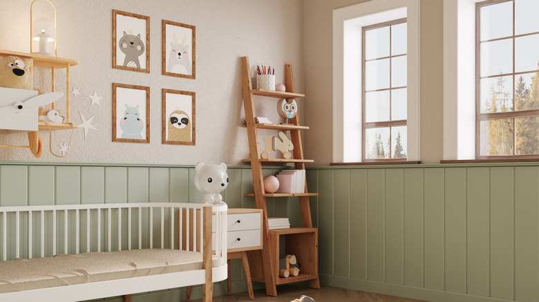 Nursery with cream-colored walls and wooden furniture