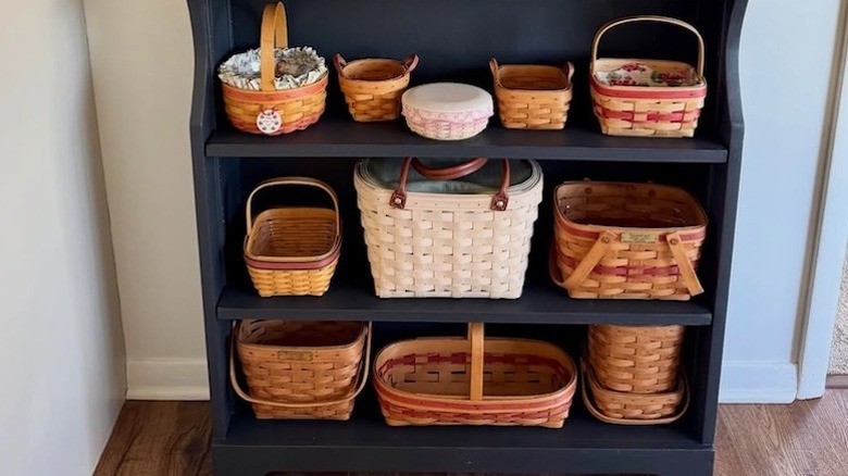 A variety of Longaberger baskets on display in a small black drawer